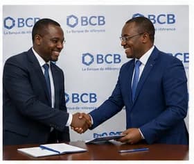 Two executives shaking hands at a BCB signing event