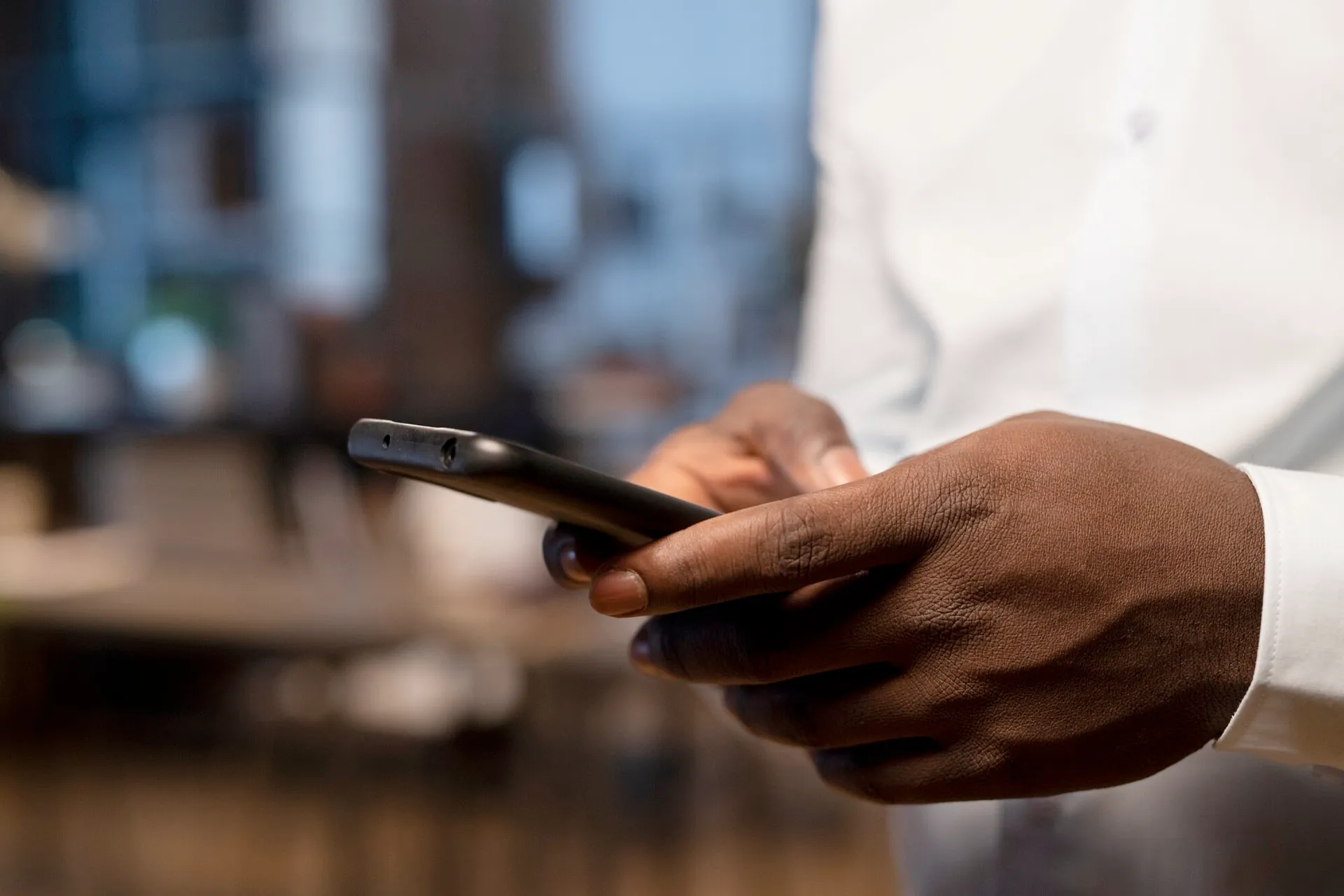 A person using the BCB mobile banking app on their phone
